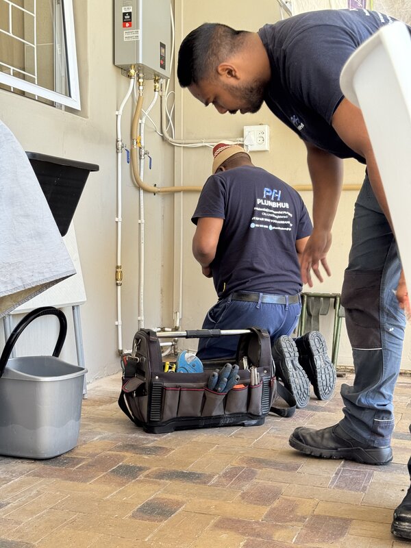Plumbhub technician with professional tools